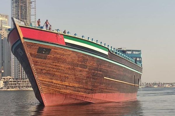 A mighty dhow sails off the shore of Dubai, recognized as the world’s largest