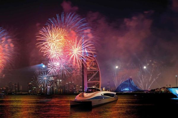 Watch NYE fireworks from the sea in an abra in Dubai