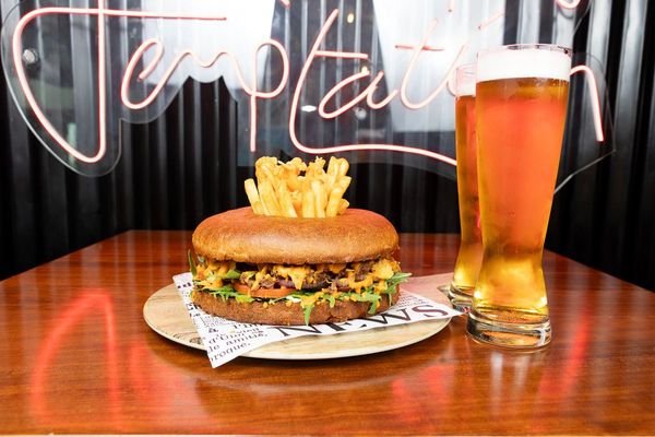 Indulge in a sizzling burger experience at South Central Kitchen Bar & Terrace