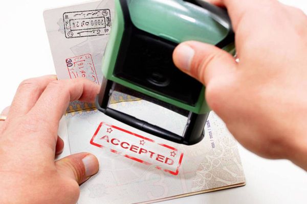 Can a Woman Sponsored by Her Husband Take Up Employment in the UAE Without Changing Her Visa Status?